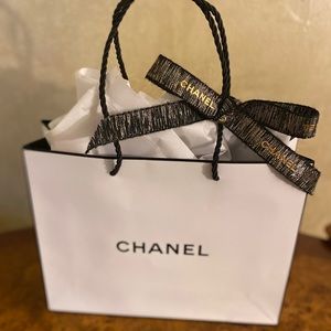 Authentic Chanel Paper gift bag with ribbon.